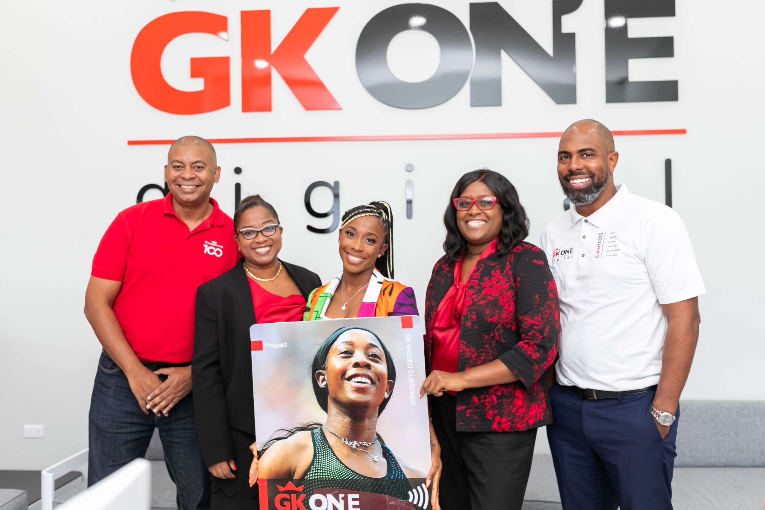 SFP with Team: GraceKennedy Brand Ambassador and face of the GK ONE pre-paid Visa Debit Card, Olympian and World Champion Shelly–Ann Fraser – Pryce posed with company executives at the GK ONE digital store at GraceKennedy’s Corporate headquarters. Fraser-Pryce is flanked by l-r Rickardo Ebanks, Chief Digital Officer; Annalise Harewood, Regional Manager, Digital Operations, GraceKennedy Money Services; Margaret Campbell, Chief Operating Officer, GraceKennedy Money Service; Steven Whittingham, Deputy CEO, GraceKennedy Financial Group.